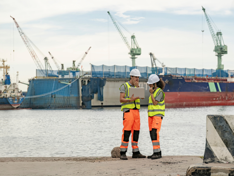Two maritime workers on a dock