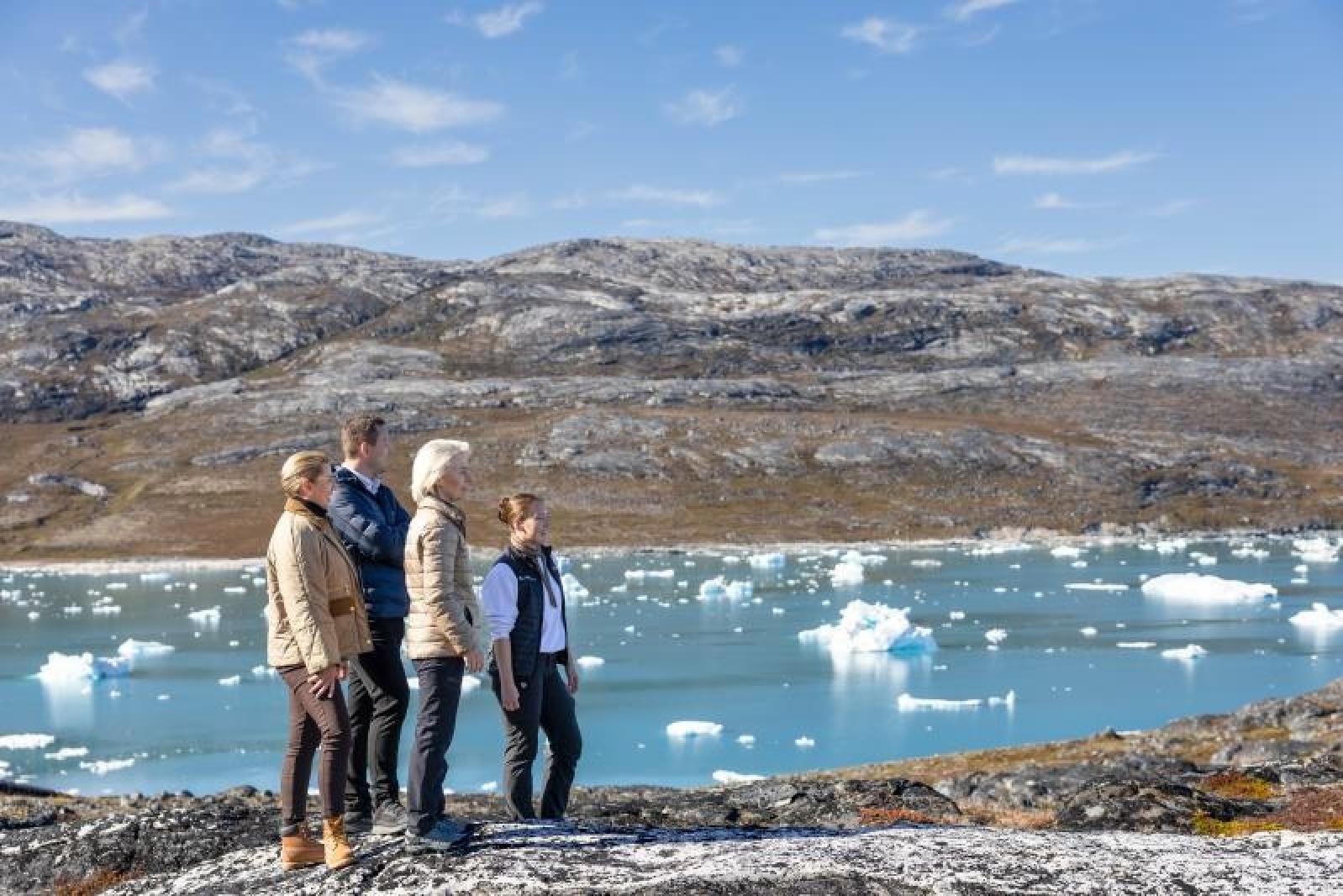 An Arctic landscape with three people 